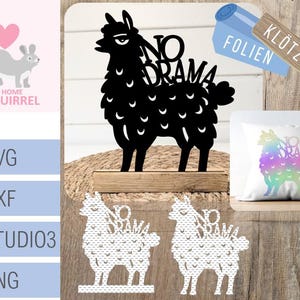 May include: A black llama-shaped cutout with the words "NO DRAMA" above it, mounted on a wooden base. The image also includes a pillow with a rainbow llama design, and SVG, DXF, STUDIO3, and PNG file formats.