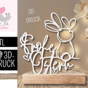 Könnte beinhalten: Weiße 3D-gedruckte Osterdekoration mit einem Hasen und den Worten "Frohe Ostern". Das Design ist auf einem Holzsockel montiert. Das Bild enthält auch eine Eichhörnchen-Grafik und den Text "The Home of Squirrel".