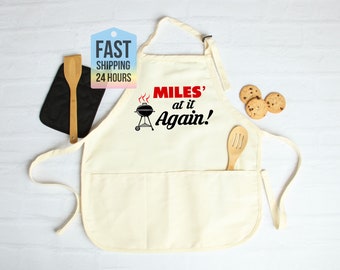 Custom Apron Your Name Is At It Again Apron, Personalized Apron, BBQ Apron, Dad Apron, Custom Gift, Grill Apron For Dad, Custom Chef Apron
