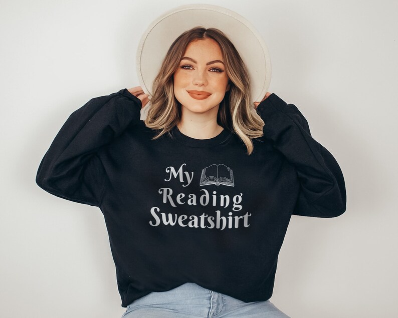 May include: A black sweatshirt with the text "My Reading Sweatshirt" and a silver outline of an open book.