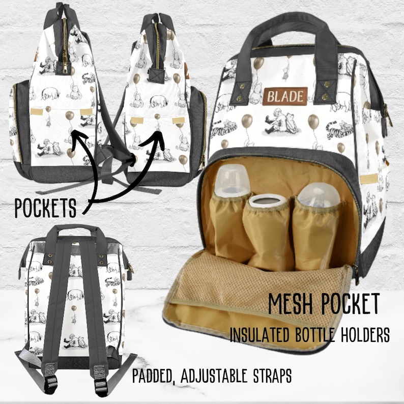 May include: A white and gray diaper bag with a Winnie the Pooh print. The bag has a large zippered compartment, adjustable straps, and insulated bottle holders. The bag also has a mesh pocket and multiple pockets on the sides. The bag has a black label with the word "BLADE" on it.