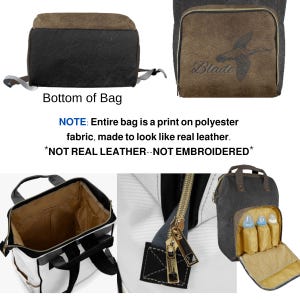 May include: A black and brown diaper bag with a flap that reads "Blade" and a duck graphic. The bag has a gold zipper and a brown top. The bag is made of polyester fabric printed to look like leather.