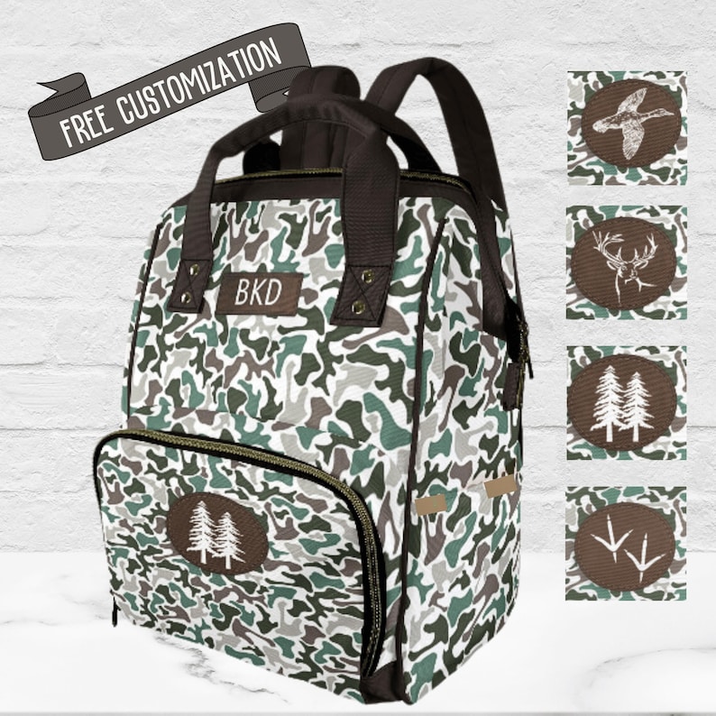 Camo Baby Bag for Men Monogram Diaper Backpack for Fathers Baby Shower Gift for New Dad Baby Boy. Personalized your diaper bag with choices for front (printed) patch : duck, deer, trees or turkey tracks.