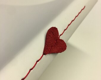 Valentine's day gift, handmade notebook-sketchbook, with a red love heart sewn on the spine. 17*20 cm