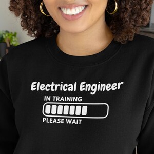 May include: Black sweatshirt with white text that reads "Electrical Engineer In Training" with a progress bar that says "Please Wait".