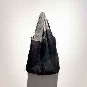 First edition denim patched round tote
