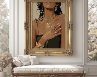 May include: A framed artwork featuring a woman adorned with gold jewelry, including necklaces, bracelets, and rings. The artwork is in a gold ornate frame, and the woman is wearing a black top. The artwork is displayed above a white bench.