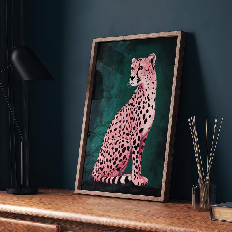 May include: A framed print of a pink cheetah sitting in a green jungle setting. The cheetah is facing to the left and has black spots.