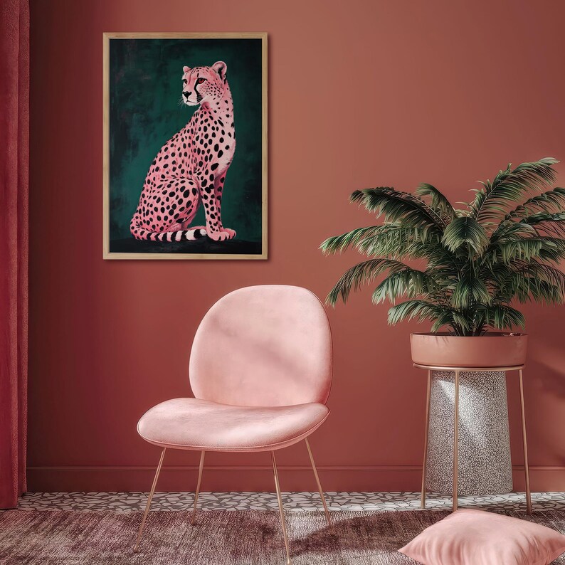 May include: A pink cheetah print art print in a wooden frame, hanging on a wall with a pink chair and a potted palm tree in the foreground.