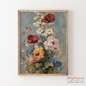K&ouml;nnte beinhalten: Gerahmter Blumendruck mit einem bunten Blumenstrau&szlig;, darunter rote Mohnblumen, wei&szlig;e G&auml;nsebl&uuml;mchen und rosa Pfingstrosen, vor einem hellblauen Hintergrund. Zwei kleine amerikanische Flaggen sind zu sehen. Das Kunstwerk befindet sich in einem Holzrahmen.