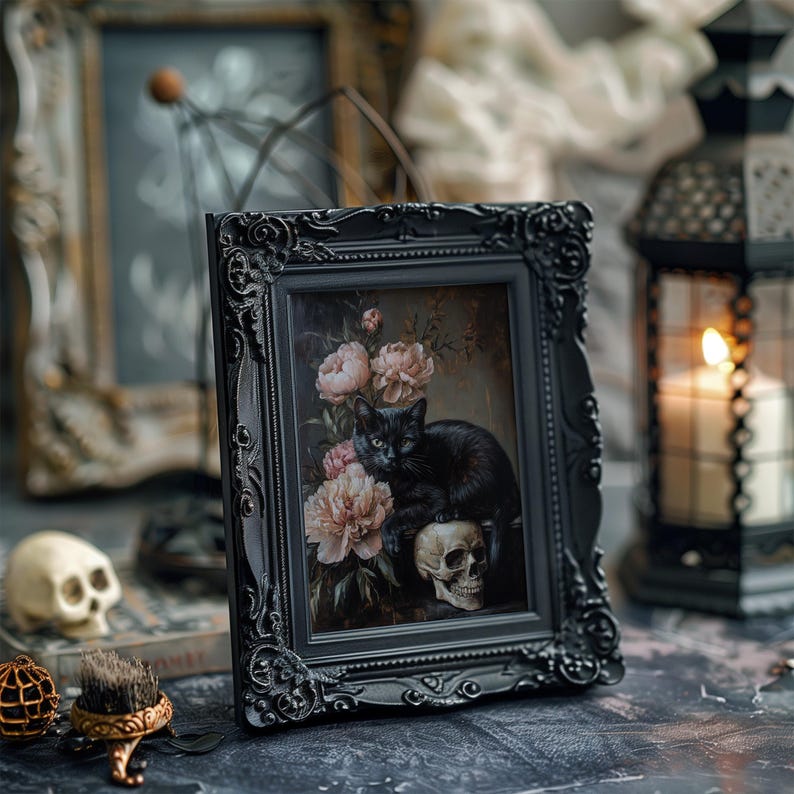 May include: A black cat sits on a skull with a bouquet of pink peonies in the background. The image is framed in a black ornate frame.