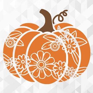 May include: Orange pumpkin with a white floral design. The pumpkin has a stem and a swirl at the top.