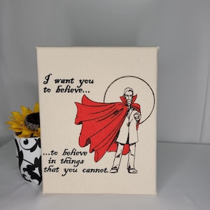 May include: A canvas print with a quote from Doctor Strange, "I want you to believe... to believe in things that you cannot."
