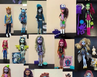 May include: A collection of Monster High dolls, each with unique features and outfits. The dolls showcase various skin tones, hair colors, and clothing styles, including dresses, tops, and accessories. Some dolls are accompanied by notebooks and small props.