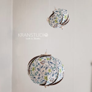 Origami hanging wall object with 5 lanterns, fine floral pattern, white green turquoise