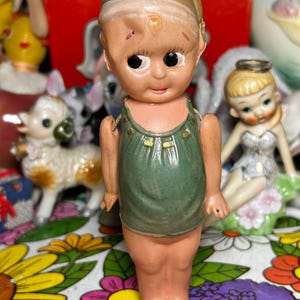 Adorable Jointed Celluloid Doll in Green