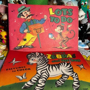 May include: Two vintage children's books. The top book is titled "Lots to Do" with a cartoon man and monkey. The bottom book is titled "Little Zebra and His Pals" with a zebra illustration and the text "Pictures to Color".
