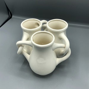 White fuddling cup vase