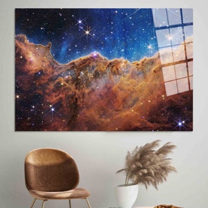 May include: A vibrant nebula with swirling orange and red hues against a dark blue background dotted with sparkling white stars.