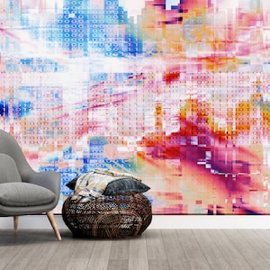 May include: Abstract digital art wallpaper with a colorful, pixelated design featuring a mix of pink, blue, and orange hues. The wallpaper is displayed in a room with a gray armchair and a small potted tree.