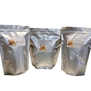 May include: Three silver foil bags of dehydrated potato products. The bags are labeled "Potato Slices", "Potato Flakes", and "Diced Potatoes". Each bag is made with 100% real Idaho potatoes.