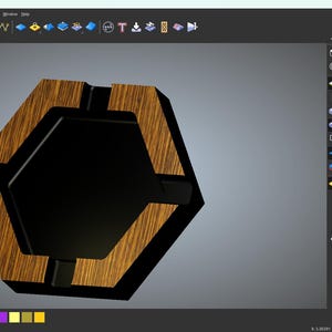 May include: A hexagonal cigar tray design with a black center and a wooden frame. The tray is a 3D rendering, showcasing a modern design. The wood has a natural grain pattern.