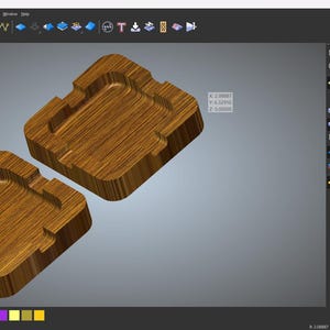 May include: Two wooden ashtrays with a square design are displayed on a computer screen. The ashtrays are a warm brown color, with a textured wood grain appearance. The design is a 3D rendering.
