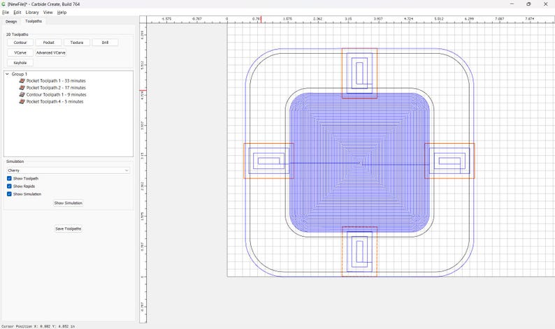 May include: Screenshot of a computer program interface. The interface displays a design with a blue rectangular shape, surrounded by a rounded square outline. Several orange and red rectangular shapes are also visible. The program's menu is on the left.