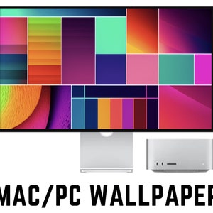 Puede incluir: Un monitor de ordenador que muestra un fondo de pantalla abstracto de colores con una variedad de formas geométricas y patrones. El monitor está conectado a un ordenador de sobremesa plateado.