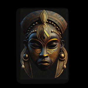 May include: A detailed, stylized African mask with a dark, matte finish. The mask features intricate gold-colored geometric patterns and embellishments, including a headdress, earrings, and facial details. The overall design is symmetrical and ornate.