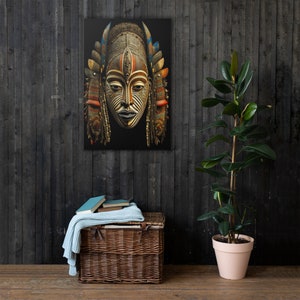 May include: A wooden mask with intricate carvings and colorful paint details. The mask has a human face with a large nose, wide eyes, and a small mouth. The mask is surrounded by a decorative frame of feathers and beads.
