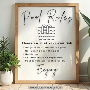May include: Wooden framed sign with the text "Pool Rules" in a stylish script font. The sign includes a pool graphic and safety guidelines: no glass, no running, no diving, child supervision, and towel location. The word "Enjoy" is also included.