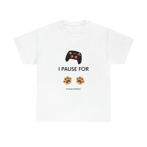 May include: White t-shirt featuring a black and red video game controller graphic and the text "I pause for" with two brown paw prints below. The text "#FUNUNCLETEESUS" is at the bottom of the shirt.