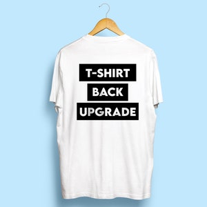 May include: White t-shirt with black text on the back that reads "T-SHIRT BACK UPGRADE"