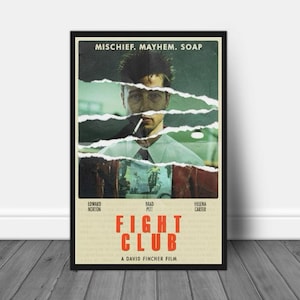 May include: A framed movie poster for "Fight Club" featuring Brad Pitt. The poster has a distressed design with torn paper effects. The title "Fight Club" is in red, with the film's credits and the tagline "Mischief. Mayhem. Soap."