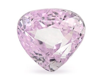 May include: A heart-shaped pink gemstone with a faceted cut.