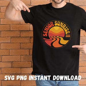 May include: Black t-shirt with a circular graphic featuring a sunset design in orange, red, and yellow, with the words "Senior Sunrise 2026". The shirt also has the text "SVG PNG INSTANT DOWNLOAD" at the bottom.