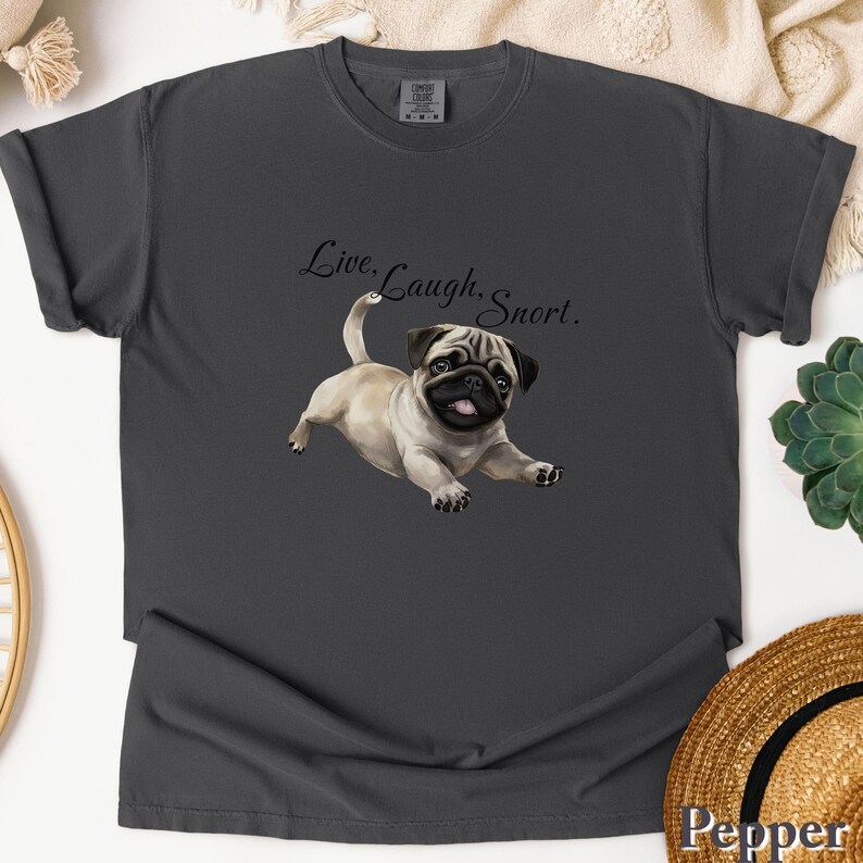 May include: A dark gray t-shirt with a cartoon pug and the text "Live. Laugh. Snort."