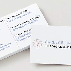Customizable medical alert cards.  Includes, name, allergens, EMS instructions, conditions, medications, emergency contact, DOB.  Shows both sides of card on a desk.