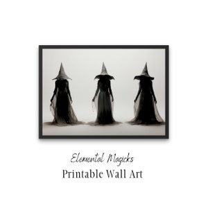 Op de afbeelding: Drie heksen in zwarte gewaden en punthoeden staan in een rij tegen een witte achtergrond. De tekst "Elemental Magicks Printable Wall Art" staat onder de afbeelding.