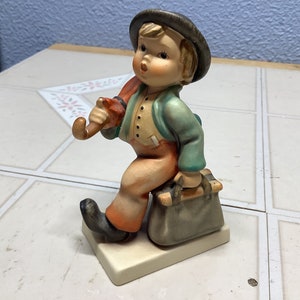 Hummel boy with umbrella and dog discount