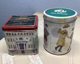 Set of Girl Scout tins,part of American history. 4 inch round depicts uniform changes.The 4 inch square from Juliette Gordon Low Birthplace