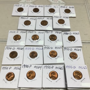 May include: A collection of 1950s and 1960s US pennies in protective plastic sleeves. The coins are arranged in rows and labeled with the year and mint mark.