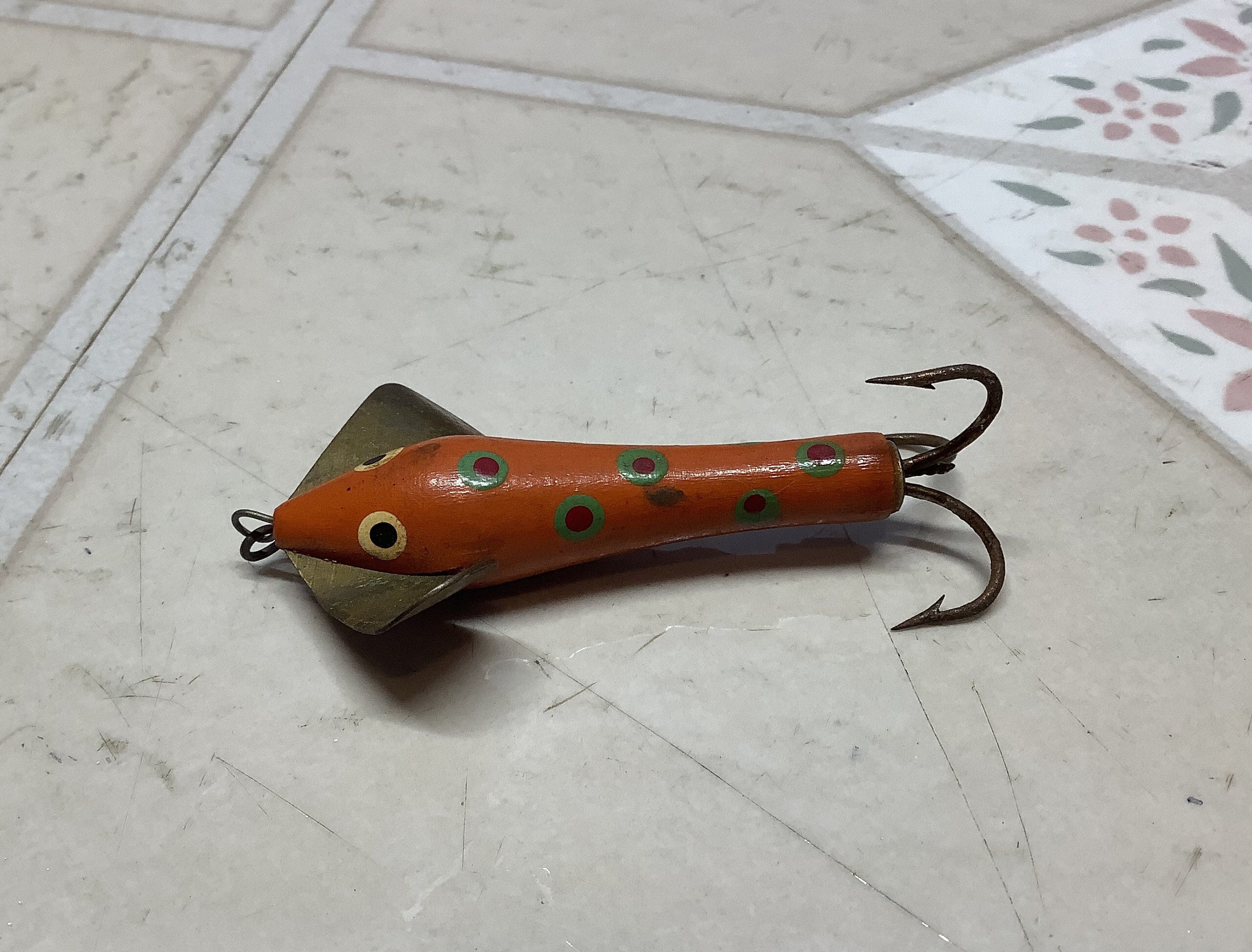 Vintage Mcginty hand made fishing lure for trolling. Painted eyes and body  with brass swivel and shaped spinner with closed metal treble