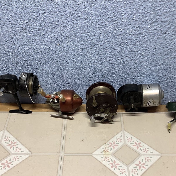 6 misfit fishing reels, for that person that will fix and restore reels handle broke, missing, or just not in placement condition nice find!