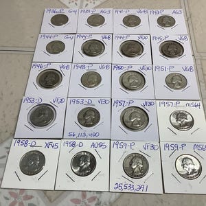 May include: A collection of vintage U.S. quarter coins, each encased in a protective holder. The coins are arranged in rows and columns, with dates ranging from 1936 to 1959. The holders are labeled with dates and grading information.