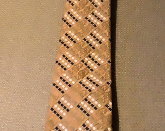 Vintage Johnny Carson dress tie from the 1980’s and only wore by me. Great condition with vibrant colors and measures 55” x 4 wide at base