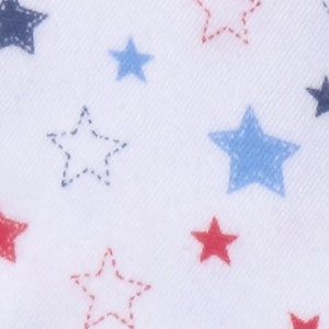 May include: White fabric with a repeating pattern of red, blue, and navy blue stars. Some stars are solid, while others are outlined with a dotted stitch. The stars vary in size and are scattered across the surface.