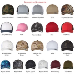May include: A variety of trucker hats in different colors and patterns, including camouflage, solid colors, and Kryptek designs. The text "Camo colors run $2 more per hat" is displayed at the top of the image.