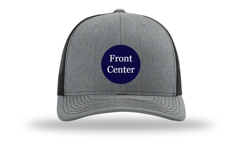 May include: A gray and black trucker hat with a navy blue circle patch that says "Front Center" in white text.